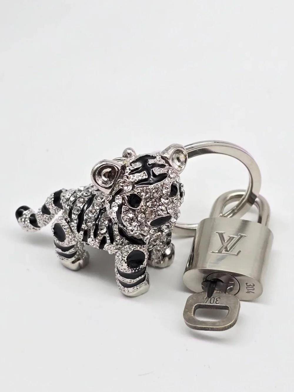 Authentic Louis Vuitton Silver Padlock with Unbranded Silver Tiger Bagcharm